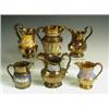 Image 1 : Six copper lustre jugs, each of shaped form, four with moulded floral sprays, one with stylise...