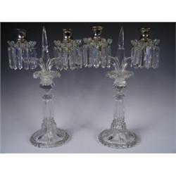 A pair of twin branch glass candelabrum each with silver plated sconces and the drip trays wit...
