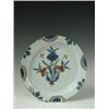 Image 1 : An English deft polychrome plate, probably Lambeth c.1760 with a stylised flower bouquet to th...