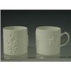 Image 1 : A pair of Bow mugs, each with moulded prunus pattern sprays to the body, and loop handles, c.1...