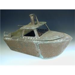A barbeque in the form of a boat, copper, on an aluminium wheelbarrow stand possibly late 1930...