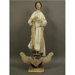 An unusual early 20th Century painted plaster figure of a girl standing on an orb base, 100cm...