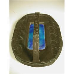 A Liberty Tudric pewter basket, with raised stylised leaves and flowers, the base inset with a...