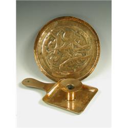 A Newlyn copper chamberstick together with a Gawthorn copper tray embossed with stylised drago...