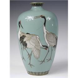 A Hyashi Kodenji fine wire cloisonnT vase decorated with red headed cranes against a sage gree...