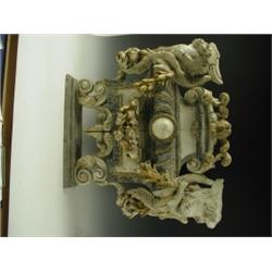 An 18th Century Italian carved plaque, with winged angels heads, leaf husks, and scrolls, 68cm...