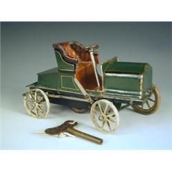 A Marklin clockwork and tinplate car in the form of an early two seat open tourer. Now painted...