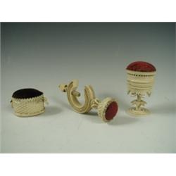 A Victorian ivory pin cushion in the form of an oval basket with ring handles, 6cm long Est...