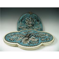 A Victorian table centre of quatrefoil shape with a beaded centre worked in blue, brown and wh...