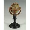 Image 1 : An early 19th Century miniature terrestrial globe on an ebonised stand, 6.5cm diameter, inscri...