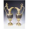 Image 1 : A pair of late l9th Century bronze and ormolu ewers, decorated with cherubs pursuing the arts...