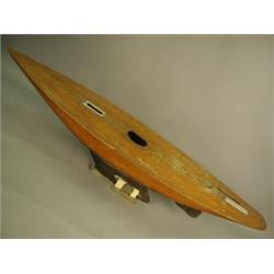 A large Victorian or Edwardian wooden pond yacht hull, 184cm long Est. 400/600...