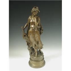 A late 19th Century French spelter figure with a bronzed finish inscribed 'Mignon', 57cm high<...