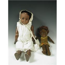A German black bisque head doll, with composition body, the head with sleeping eyes and open m...