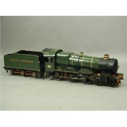 A live steam model of a 4-4-0 Great Western Locomotive and tender, painted in a green livery 3...