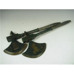 A pair of ceremonial axes, painted green with crests and symbols, 56cm Est. 200/300...
