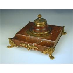 A mid 19th Century inkwell, the kidney veined marble with gilt metal mounts, with inscription...