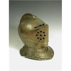A 19th Century German close face helmet, 40cm high Est. 500/800...