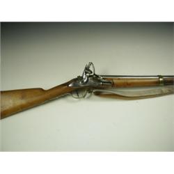 A French flintlock musket, the lock signed 'Manue De Versailles' with brass bands and trigger...