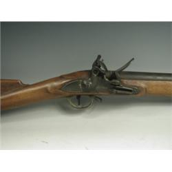 A Reynolds flintlock musket, the stock with brass mounts Est. 400/600...