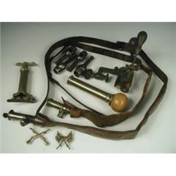 Two 19th Century leather and brass shot or powder belts, 2 cartridge refillers, a marksmans ba...