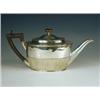 Image 1 : A Victorian silver oval teapot, with half gadrooned decoration, an ebonised handle and knop, m...