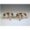 Image 1 : A pair of George III silver salts, each of circular form, raised on three pad feet, makers mar...