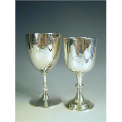 A Victorian silver goblet with engraved decoration, monogram and date, Birmingham, 1871, and a...