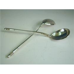 A pair of Russian silver spoons with intertwined engraved bowls, stamped with makers mark, 186...