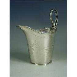 A George III silver cream jug, with bright cut floral swags, Sheffield, 1793, 10.5cm high E...