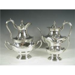A silver four piece teaset, comprising teapot, hot water and milk jug and twin handled sugar,...