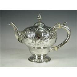 An early George III melon shape teapot with later Victorian floral repousse decoration, 24oz L...