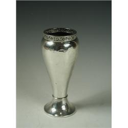 A weighted silver vase by A E Jones with a pierced border and hammered finish, Birmingham, 192...