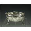 Image 1 : An Art Nouveau silver bowl embossed with bullrushes below a shaped rim, raised on 3 scrolled f...