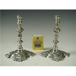 A pair of silver taper sticks, in early 18th Century style, by Garrard & Co Ltd., 1934, 12cm h...
