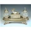 Image 1 : A Victorian silver plated desk stand, with 2 globular cut glass inkwells, a seated stag and 2...