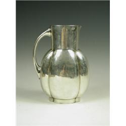 A Gallia silver plated jug of bellied melon form, 21cm high Est. 200/300...