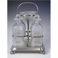 A l9th Century silver plated 4 bottle decanter stand with raised central cut glass bowl, all u...