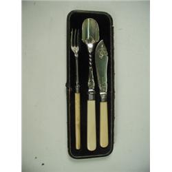 A cased three piece set comprising: fish knife, stilton scoop and pickle fork, with plated bla...