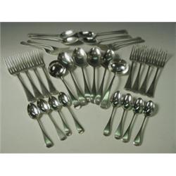 A Harlequin part canteen of Old English silver flatware comprising 11 dessert spoons, 9 table...