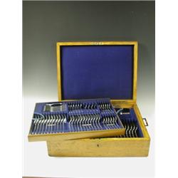 A Victorian plated fiddle pattern table service for twelve in an oak canteen by James Dixon &...