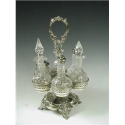 A Victorian silver plated condiment stand with 6 original cut glass bottles, 32cm high Est....