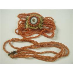 A coral 8-strand beaded bracelet with a pinchbeck and mother of pearl clasp and a 2-strand cor...