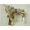 Image 1 : A sapphire and diamond spray brooch set in yellow metal, (tests gold) with a safety chain, 5cm...