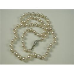 A single row of 60 cultured pearls, with a diamond set clasp (total approx 0.65ct), 56cm long<...
