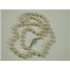 Image 1 : A single row of 60 cultured pearls, with a diamond set clasp (total approx 0.65ct), 56cm long<...