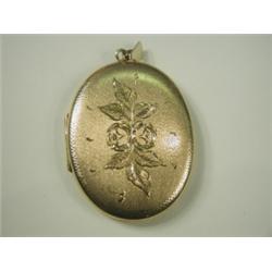 A 9ct gold locket with textured and bright cut decoration, 6.5cm long, 24.1g Est. 100/150...