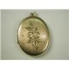 Image 1 : A 9ct gold locket with textured and bright cut decoration, 6.5cm long, 24.1g Est. 100/150...