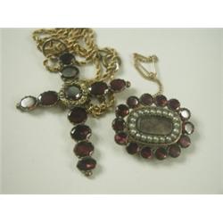 Two Victorian garnet set items: a cross pendant, 5cm long on a rope chain and a brooch also se...