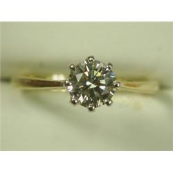 A diamond solitaire ring of approx 1ct (with certificate: clarity VVS1, light yellow), set in...